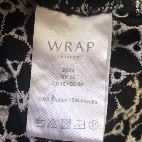 WRAP London black & white button close dress with open front pockets.  Size 18. - Picture 9 of 11